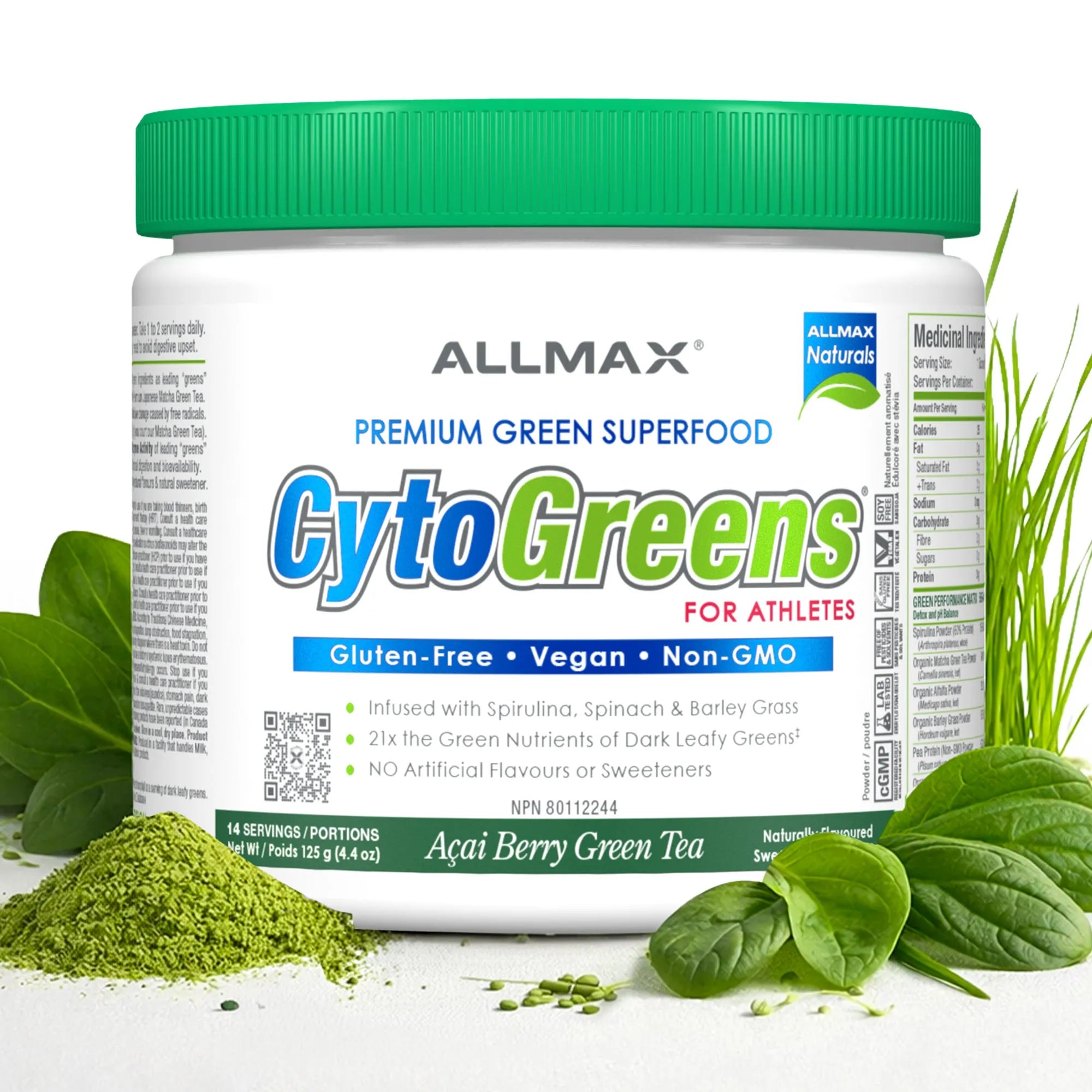A white plastic tub of Allmax CytoGreens Premium Green Superfood with a bright green lid, surrounded by fresh green spinach leaves and a pile of green powder on a white background.