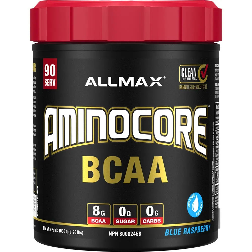 A tub of Allmax Aminocore BCAA dietary supplement powder in Blue Raspberry flavor. The container has a black label with a bright red lid, featuring white and gold text, and nutritional callouts indicating 8g BCAA, 0g sugar, and 0g carbs.